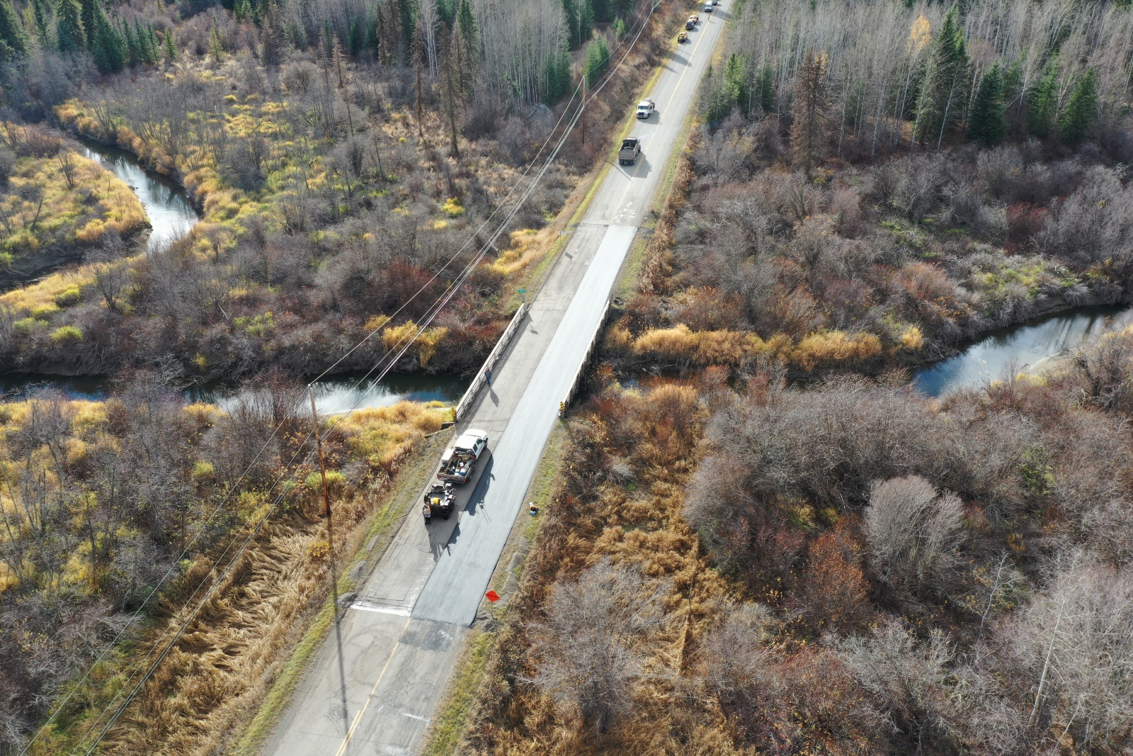 Dawson Road Maintenance and Dawson Construction paving at McNeil-Hendrix Bridge in 100 Mile House