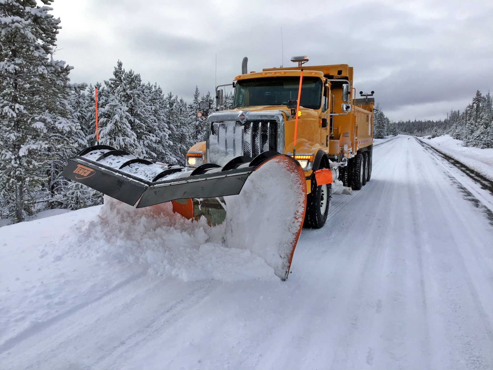 Dawson Road Maintenance plowing in an International HX series in the Cariboo