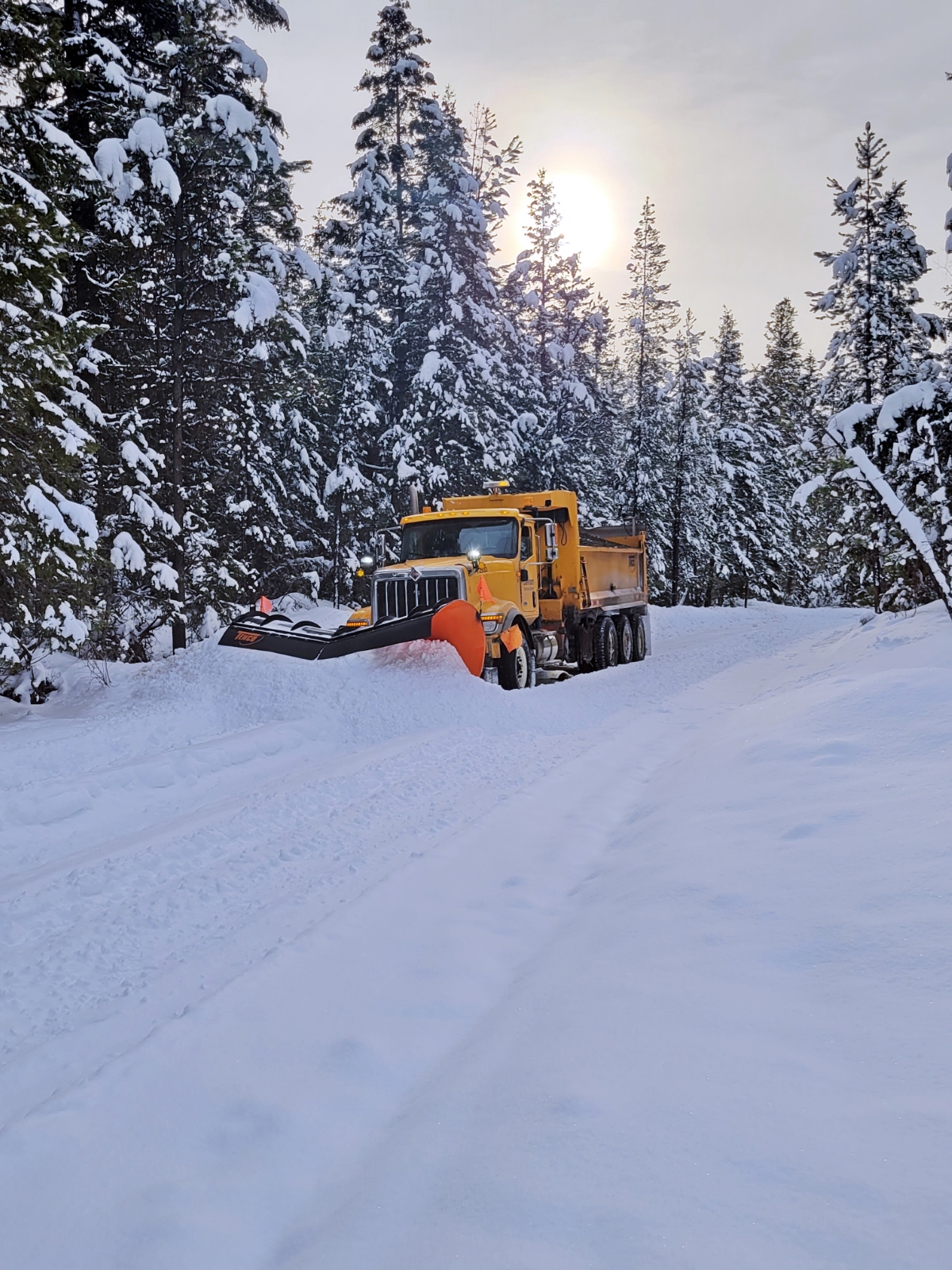 Dawson Road Maintenance plowing snow at Helena Lake in the Cariboo