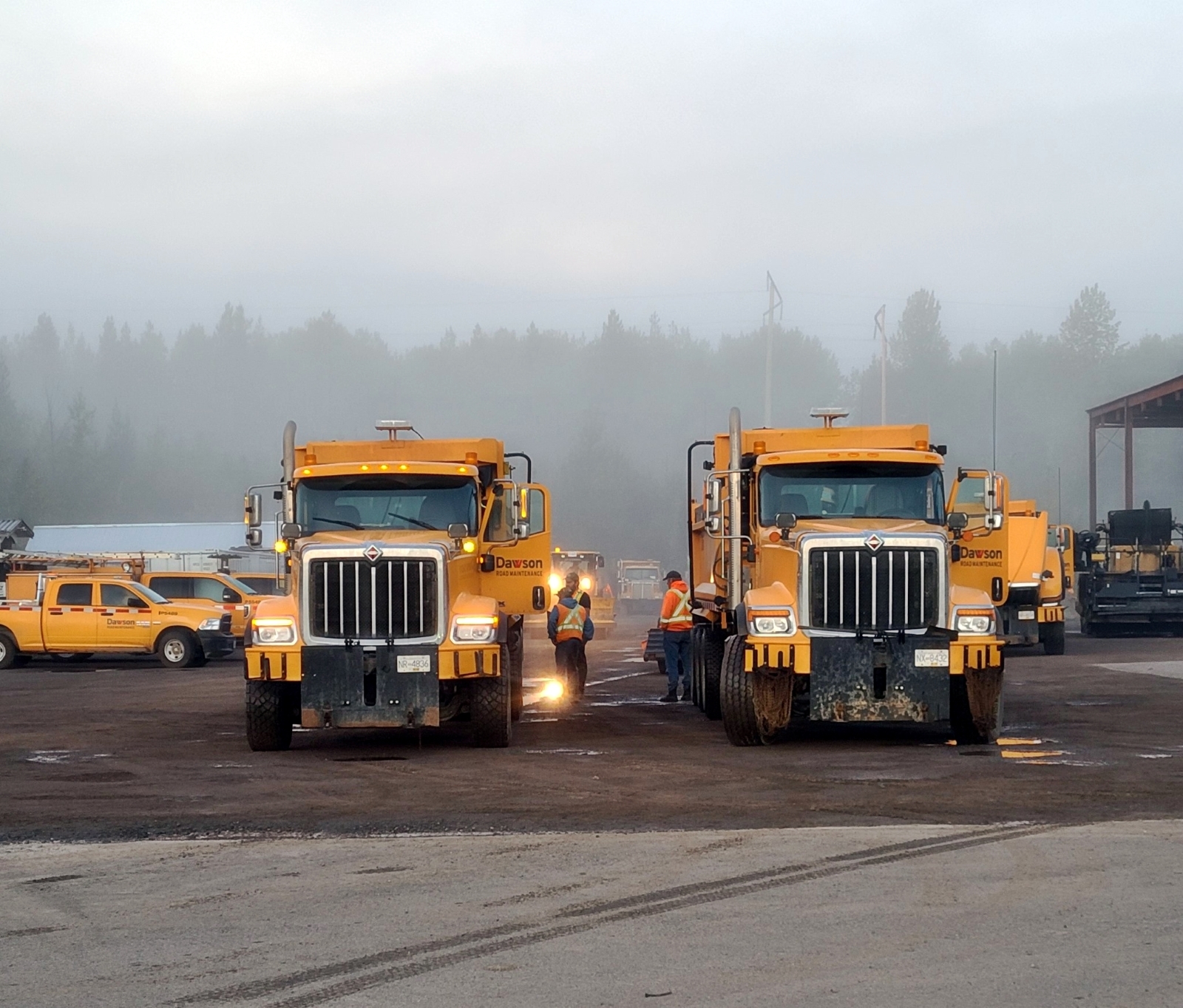 Dawson Road Maintenance team checking out new International HX Series Plow Trucks from Dawson International Truck Centres